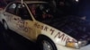 A car parked outside police headquarters in Ferguson, Missouri, carries its own messaging, conveyed via a reporter's tweet, on Nov. 21, 2014. 