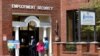 FILE - Job seekers line up outside the New Hampshire Works employment security job center, in Manchester, New Hampshire, May 10, 2021. 