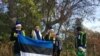 Team Estonia, which participated in the EU representatives' tree-planting effort in Washington, was led by Ambassador Jonatan Vseviov, second from left, and featured Johannas, age 2½, son of Ranner Selge, IT specialist at the embassy. (Natalie Liu/VOA) 