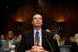 FILE - FBI Director James Comey prepares to testify on Capitol Hill in Washington, May 3, 2017, before the Senate Judiciary Committee hearing: "Oversight of the Federal Bureau of Investigation."