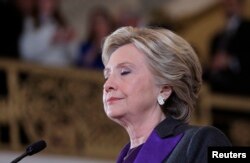 FILE - Hillary Clinton pauses as she addresses her staff and supporters about the results of the U.S. election at a hotel in the Manhattan borough of New York, Nov. 9, 2016.