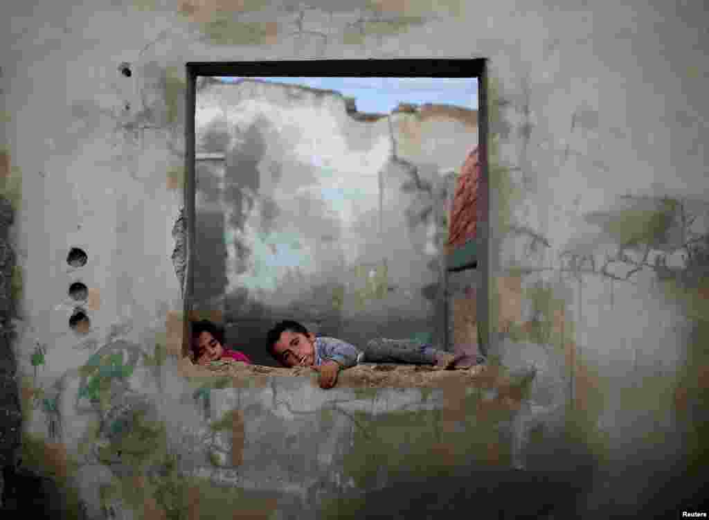 Palestinian children play at their family&#39;s house in Al-Shati refugee camp in Gaza City.
