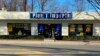 A customer steps out of a Pier 1 Imports store which was having a closeout sale, in Larchmont, N.Y., Feb. 17, 2020.
