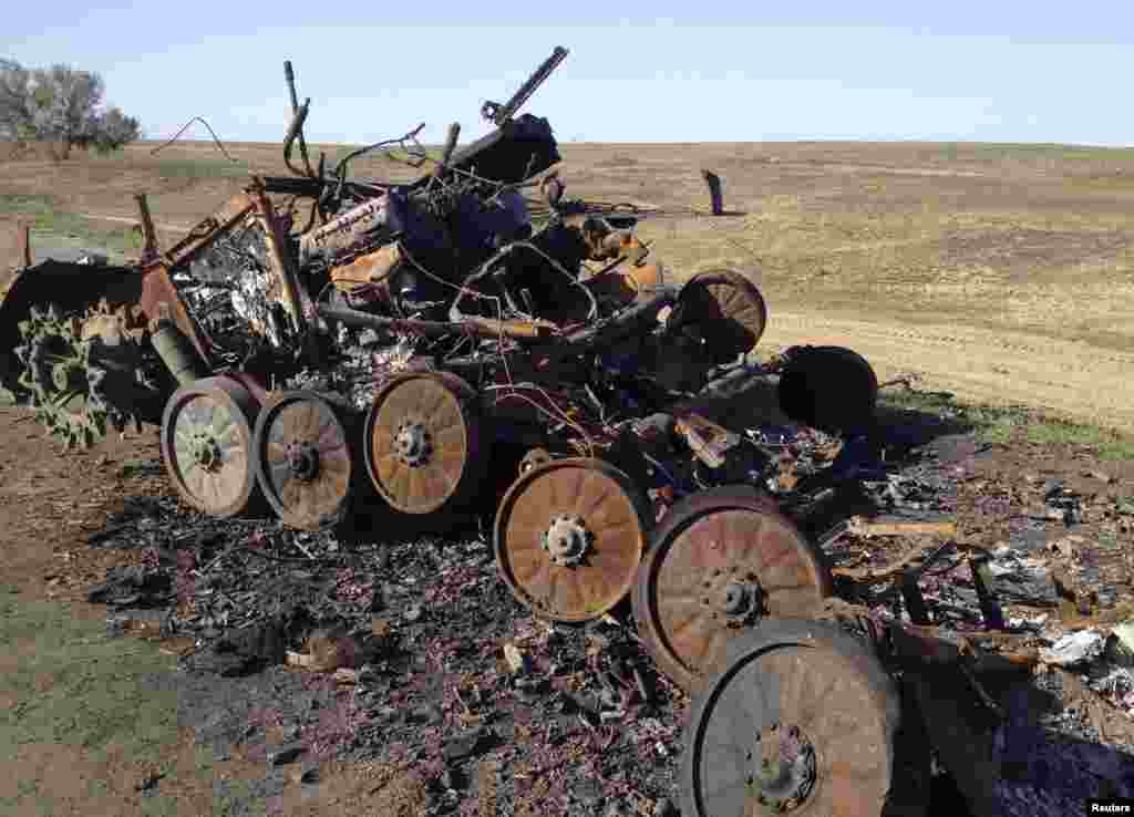 A destroyed Russian-made armored personnel carrier BMP-2 sits on a road near Starobesheve, &nbsp;in eastern Ukraine, Oct. 2, 2014. 