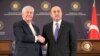 FILE - Turkey's Foreign Minister Mevlut Cavusoglu, right, shakes hands with U.S. Secretary of State Rex Tillerson after a joint news conference following their meeting in Ankara, Turkey, Feb. 16, 2018.
