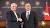 Turkish Foreign Minister Mevlut Cavusoglu, right, shakes hands with U.S. Secretary of State Rex Tillerson, after a joint news conference following their meeting in Ankara, Turkey, Feb. 16, 2018.