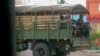 FILE - Myanmar troops and police patrol in Kayah state, eastern Myanmar, May 23, 2021. The U.N. rights office has expressed concern over recent military deployments in Chin state, Central Sagaing and Magway regions. 
