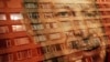 A building is reflected onto a poster of Turkey's President Recep Tayyip Erdogan, decorating a bus stop in Istanbul, June 15, 2018. Turkey holds parliamentary and presidential elections on June 24, 2018.