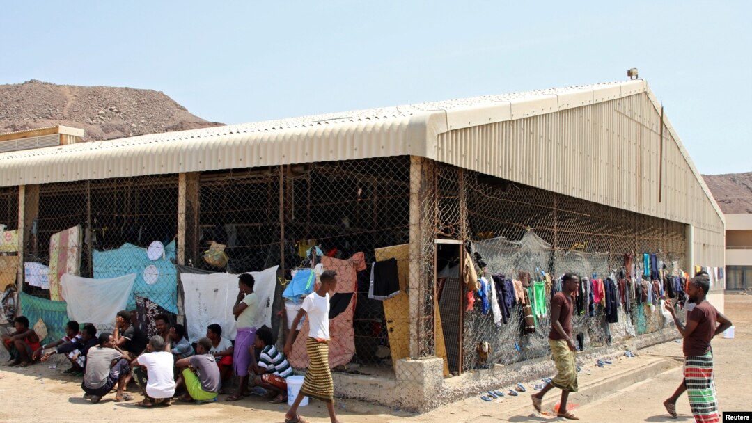 FILE - African migrants are pictured at a deportation center in Aden, Yemen, March 17, 2018.