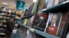 Book about US President-elect Donald Trump "Black Swan, Political Biography of Donald Trump" and a book about Russian President Vladimir Putin are on a display in the Moscow House of Books in Moscow, Russia, Nov. 14, 2016. 
