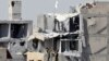 Fighters of Syrian Democratic Forces raise a white flag near the National Hospital complex where the Islamic State militants are holed up, at the frontline in Raqqa, Syria, Oct. 16, 2017. 