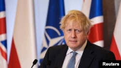 Britain's PM Johnson visits Polish counterpart in Warsaw