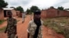 FILE - Seleka rebels walk through the town of Bria, Central African Republic, July 15, 2013. Recent fighting between rival militia groups, some in Bria, has killed 16 people, U.N. peacekeepers said Wednesday, Nov. 23, 2016.