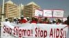 People holding banners march to campaign for increased aids awareness in the streets of Nigeria's capital Abuja December 1, 2006 on World Aids Day.