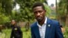 Uganda's leading opposition challenger Bobi Wine walks back to his residence after giving a press conference outside Kampala, Uganda, Jan. 15, 2021, one day after Ugandans went to the polls. 