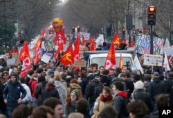 Demonstrators hold union flags march during a rally in Paris, France, March 9, 2016.
