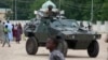 Nigerian soldiers ride on an armored personnel carrier during Eid al-Fitr celebrations in an area of Nigeria where an Islamic insurgency is raging, in Maiduguri, Nigeria, Aug. 8, 2013.