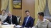Russian President Vladimir Putin (2nd L) and Syrian President Bashar al-Assad (2nd R) meet with servicemen as they visit the Hmeymim air base in Latakia Province, Syria, Dec. 11, 2017. 