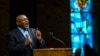 Pastor Tommie Pierson preaches during a Thanksgiving service that discussed the reaction in Ferguson, Missouri, to developments in the Michael Brown case, Nov. 27, 2014. 
