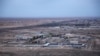 FILE - An aerial photo taken from a helicopter shows Ain al-Asad air base in the western Anbar desert, Iraq, Dec. 29, 2019.