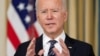 FILE - U.S. President Joe Biden speaks in the State Dining Room at the White House in Washington, March 15, 2021.