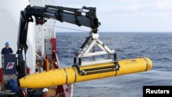 FILE - The U.S. Navy's Bluefin-21 underwater drone is shown April 14, 2014. A Florida woman has been charged with illegally exporting technology used in underwater drones to China.