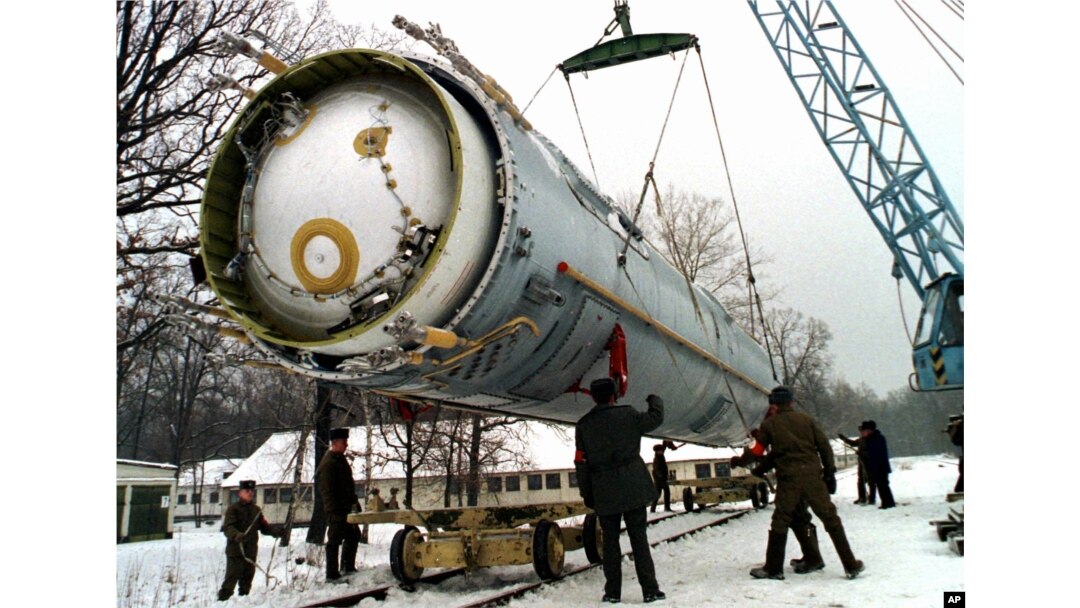 FILE - Soldiers prepare to destroy a ballistic SS-19 missile in the yard of the largest former Soviet military rocket base in Vakulenchuk, Ukraine, Dec. 24, 1997.
