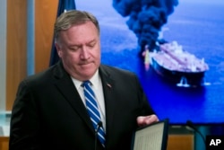 Secretary of State Mike Pompeo closes his remarks as he departs after a media availability, at the State Department, June 13, 2019.