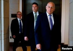 FILE - White House Chief of Staff John Kelly (R) and President Donald Trump's attorney Emmet Flood (L) arrive for a classified briefing for the U.S. congressional leadership from FBI and intelligence officials on the FBI probe into Russia's meddling in the 2016 election held in the U.S. Capitol building on Capitol Hill in Washington, U.S., May 24, 2018.