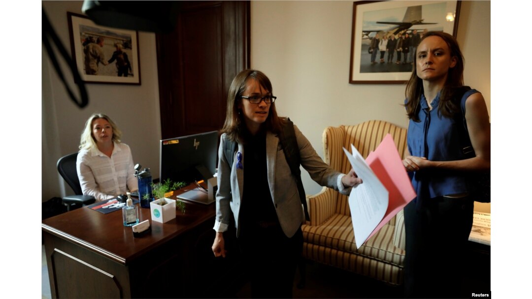 Holton-Arms alumna Alexis Goldstein (C) and Sarah Burgess arrive at office of Senator Shelley Moore Capito (R-WV) to deliver a letter from more than 1,000 fellow Holton-Arms high school graduates supporting fellow graduate Dr. Christine Blasey Ford and their belief in her accusations against Supreme Court nominee Brett Kavanaugh on Capitol Hill in Washington, Sept. 20, 2018.