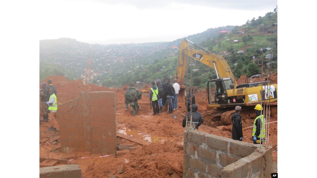 Rescue workers search for survivors following a mudslide in Regent, east of Freetown, Sierra Leone, Aug. 14 , 2017.
