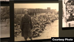Photo of U.S. officer in front of bodies of prisoners in the Dachau concentration camp after liberation, displayed at Yad Vashem's "Flashes of Memory" exhibition in Jerusalem, Jan. 24, 2018.