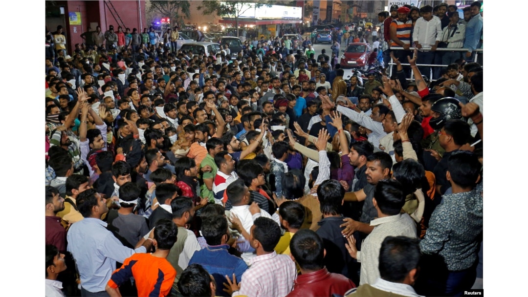 Demonstrators shout slogans outside a multiplex during a protest against the release of the upcoming Bollywood movie 'Padmaavat' in Ahmedabad, India, Jan. 23, 2018.