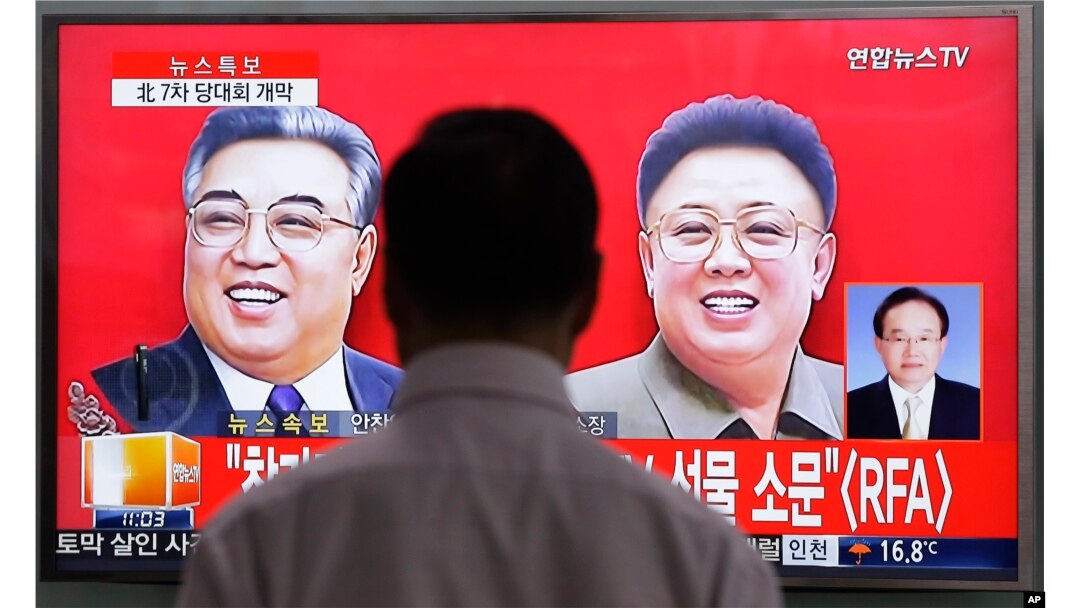 FILE - A TV screen shows pictures of North Korean leader Kim Jong Un's late father Kim Jong Il, right, and late grandfather Kim Il Sung, left, at the Seoul Railway Station in Seoul, South Korea, May 6, 2016.
