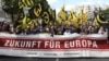 FILE - Protestors carry a banner that reads: "Future for Europe" during a demonstration of the far-right Identitarian Movement (Identitaere Bewegung) in Berlin, June 17, 2017.