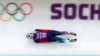 FILE - Russia's Semen Pavlichenko speeds down the track during a men luge training at the Sanki sliding center in Rosa Khutor, a venue for the Sochi 2014 Winter Olympics. 