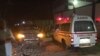 FILE - An Aamin Ambulance waits as Somali security forces end an al-Shabab siege of two Mogadishu restaurants, June 2017.