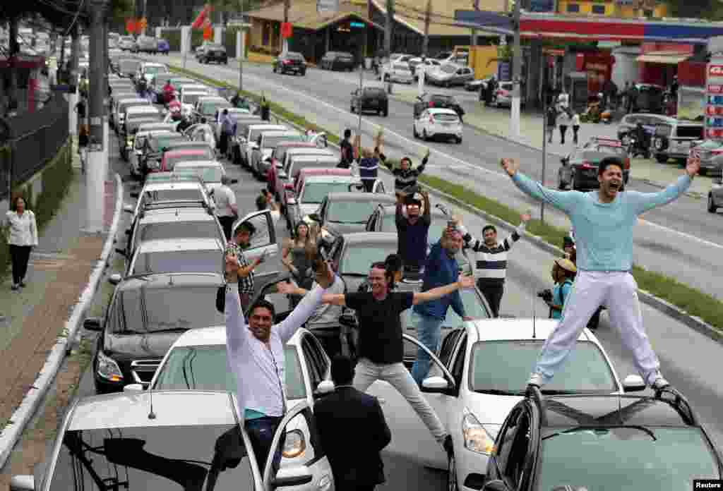 Uber drivers protest against a legislation threatening the company's business model that is to be voted in the country's national congress, in Sao Paulo, Oct. 30, 2017.