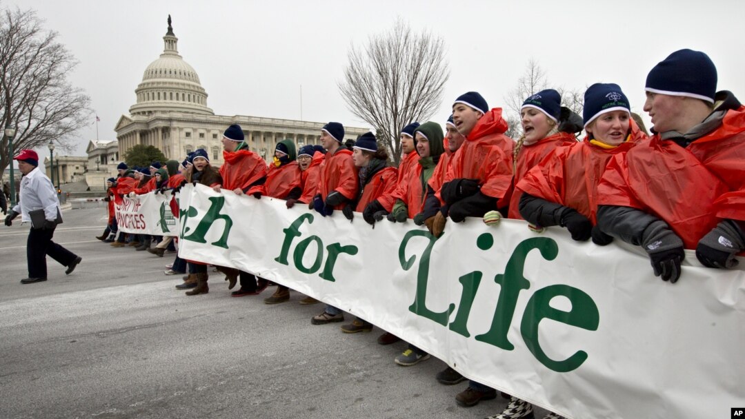 Anti-abortion activists march past the Capitol in Washington, Friday, Jan. 25, 2013, to the Supreme Court as they observe the 40th anniversary of the Roe v. Wade decision.