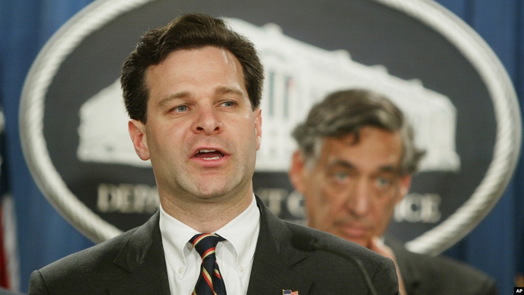FILE - Then-Assistant Attorney General Christopher Wray speaks during a press conference at the Justice Department in Washington, Nov. 4, 2003. 
