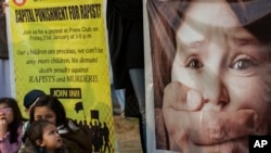 In this Feb. 4, 2020 photo, Pakistani villagers gather outside the home of student Muhimman, who was allegedly abused by a cleric, in Pakpattan, Pakistan.