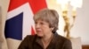 British Prime Minister Theresa May calls President Donald Trump's retweeting of anti-Muslim videos "wrong."