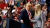 FILE - President Donald Trump greets his daughter Ivanka Trump as she arrives to speak during a rally in Cleveland, Nov. 5, 2018