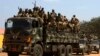 SPLA soldiers drive in a truck in Juba, South Sudan, Dec. 21, 2013. 