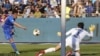 An Esteghlal player fires a shot against the Persepolis goalkeeper as two of Iran's fiercest rival football teams met at Azadi Stadium in Tehran, March 1, 2018.