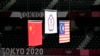 东京奥运会羽毛球男双颁奖台上，台湾选手李洋与王齐麟获金牌，中国选手李俊慧与刘雨辰获银牌，马来西亚选手获铜牌。（2021年7月31日） 