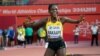 FILE - Halima Nakaayi, of Uganda, celebrates as she wins the gold medal in the women's 800 meter final at the World Athletics Championships in Doha, Qatar, Sept. 30, 2019.