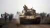 Turkish army tanks enter Afrin, an enclave in northern Syria controlled by U.S.-allied Kurdish fighters, in Hassa, Hatay, Turkey, Jan. 22, 2018. 