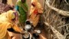 Women cook on a stove made out of mud at a women development program center funded by the WFP at Shagra village in North Darfur, October 18, 2012 file photo. 