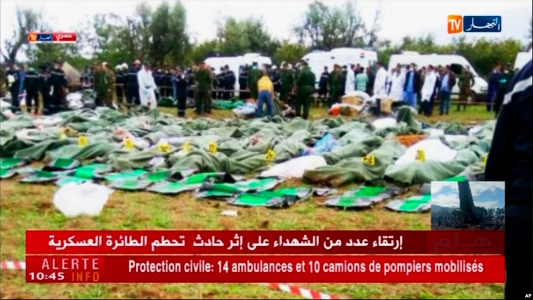 Image taken from Algerian TV network Ennahar shows body bags of victims placed near the scene after a military plane which crashed soon after takeoff from Boufarik military base, near the Algerian capital, April 11, 2018. 